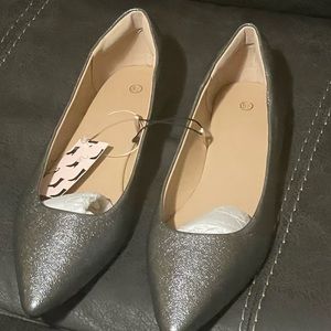 Woman’s silver flat.  New without tags. Made in china. Comfortable fit.